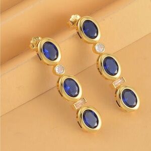 Blue and White Swarovski 
Ears in 14K Yellow Gold Over Sterling Silver 5.80 ctw